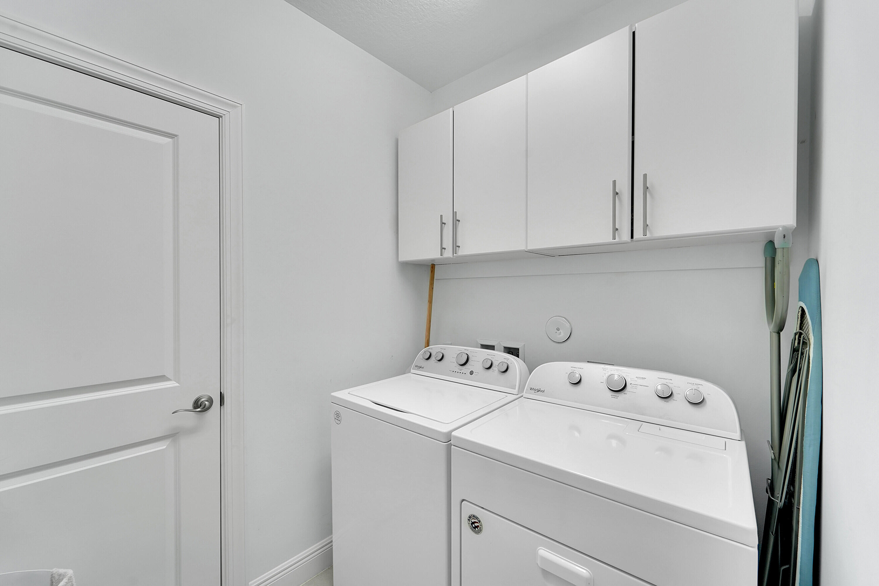 1821 Sandpiper Pointe Place, Unit 1821 Deerfield Beach, FL 33442 - Photo 22 of 24 a utility room with dryer and washer