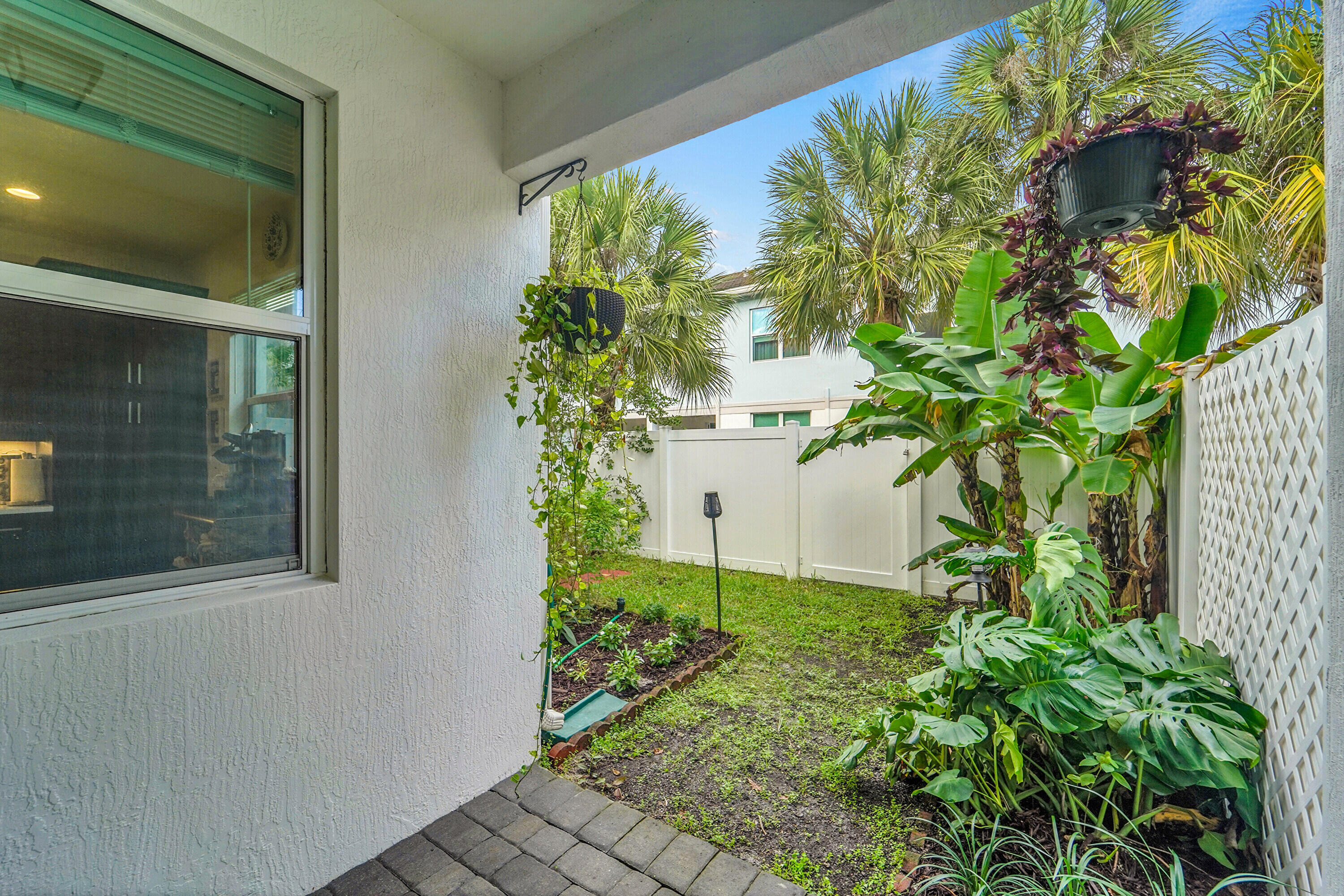 1821 Sandpiper Pointe Place, Unit 1821 Deerfield Beach, FL 33442 - Photo 23 of 24 a plant that is in front of a window