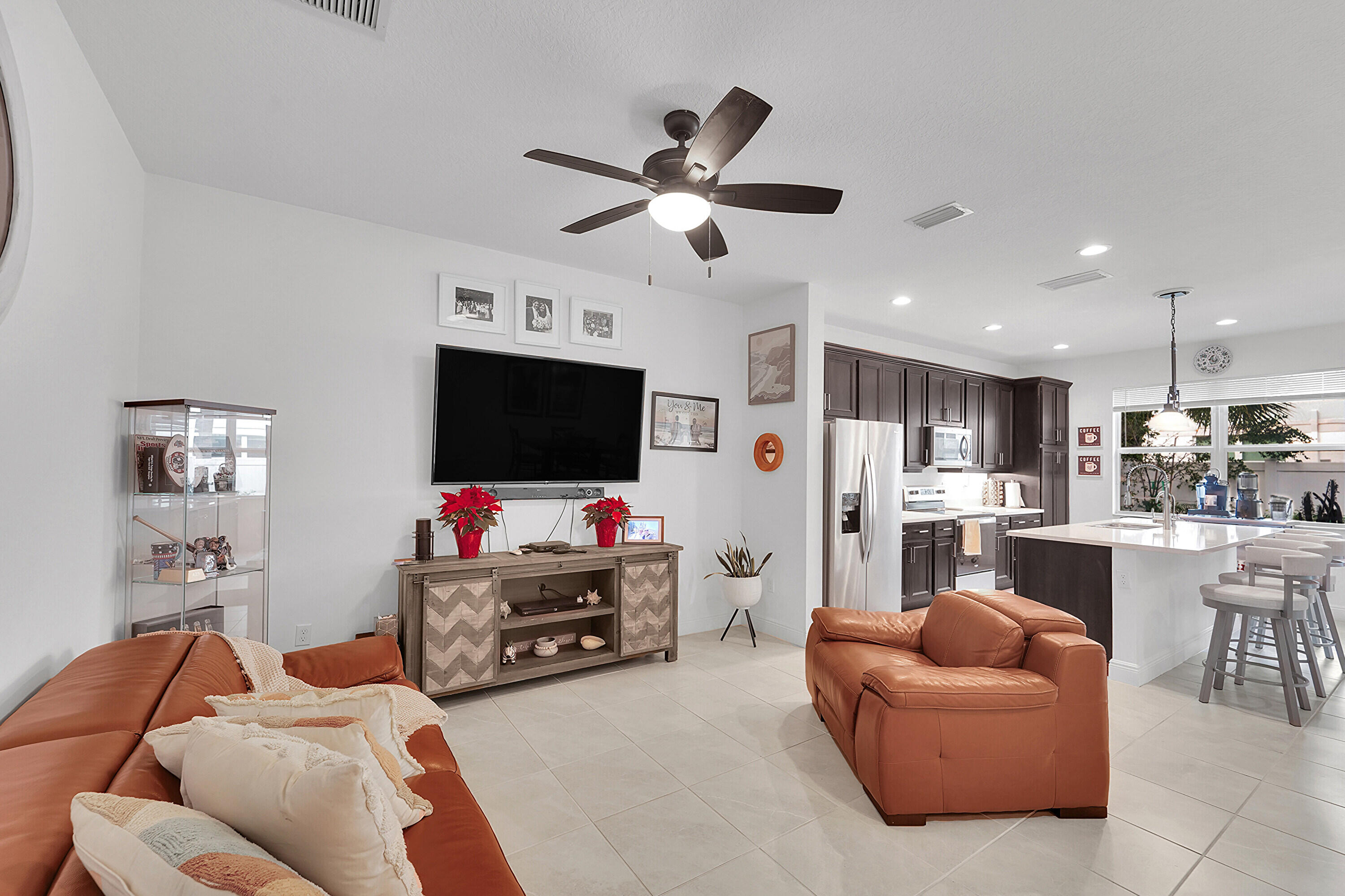1821 Sandpiper Pointe Place, Unit 1821 Deerfield Beach, FL 33442 - Photo 7 of 24 a living room with furniture and a flat screen tv