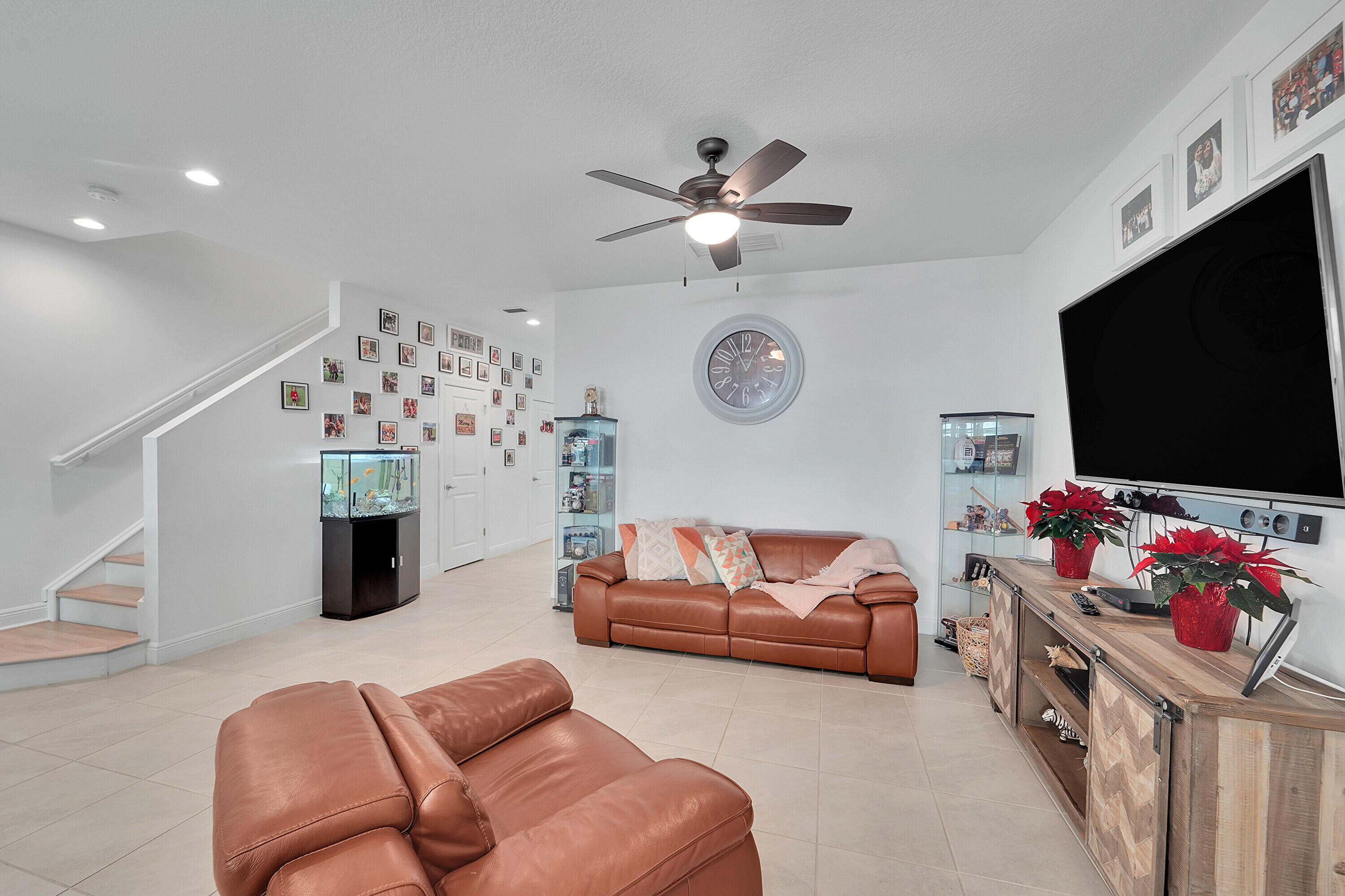 1821 Sandpiper Pointe Place, Unit 1821 Deerfield Beach, FL 33442 - Photo 8 of 24 a living room with furniture and a flat screen tv