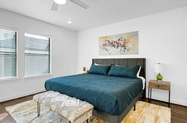 a bedroom with a bed and a couch