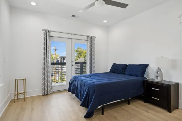 a bedroom with a bed and a book shelf
