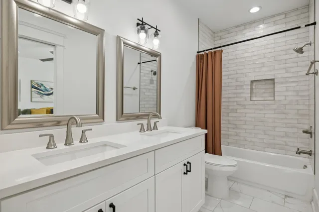 a bedroom with a bed and a lamp