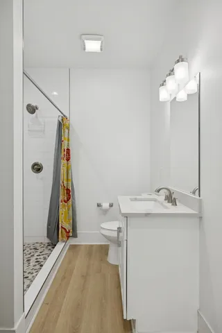 a view of balcony with wooden floor