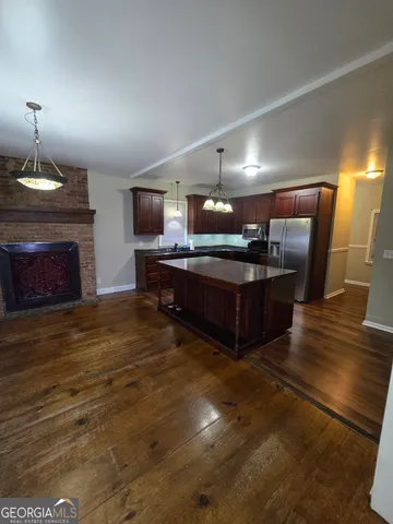 a view of kitchen with furniture and fireplace