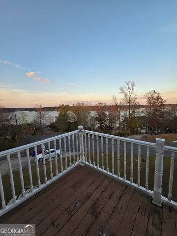 a balcony with wooden floor