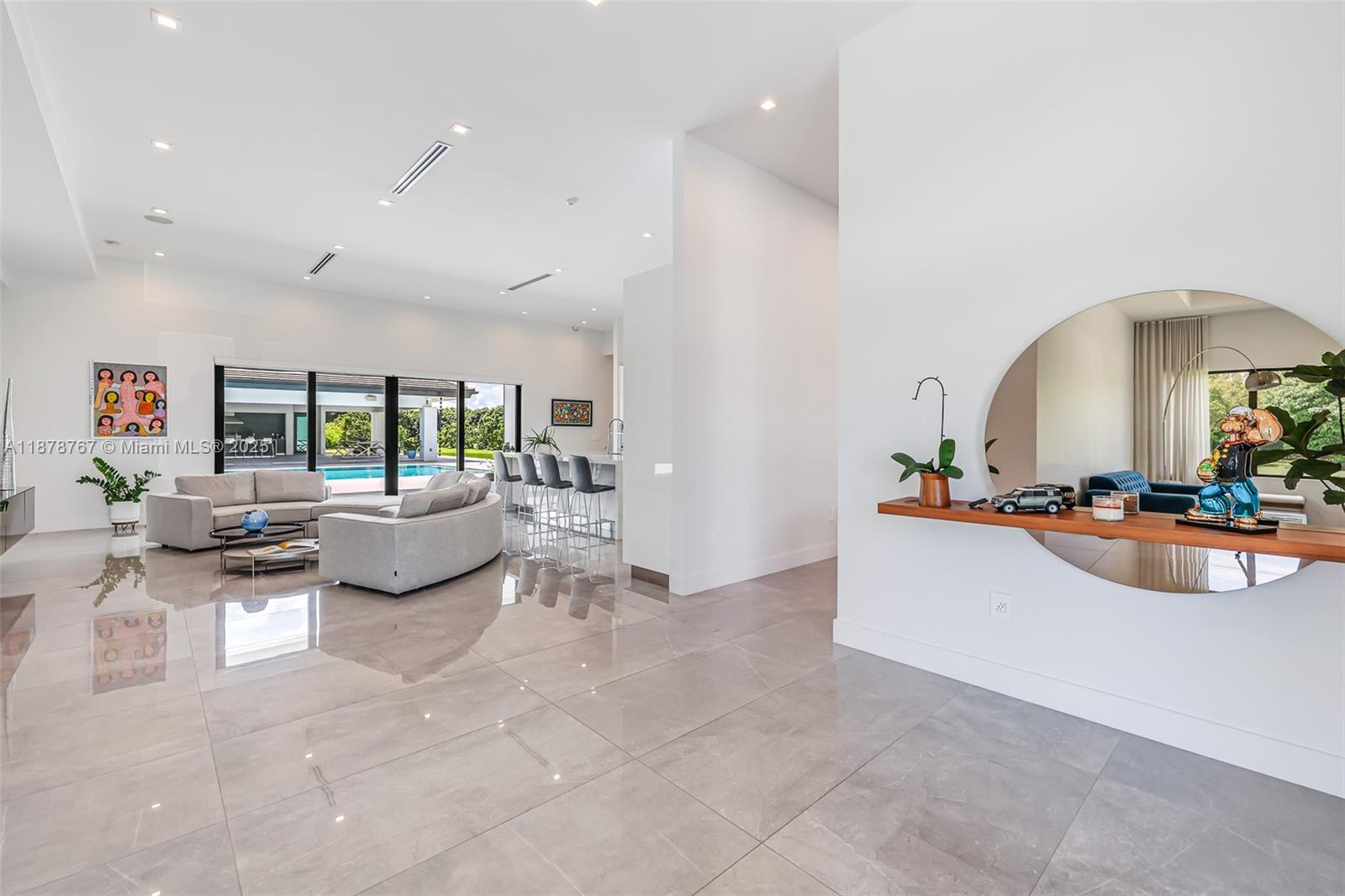 17950 Southwest 192nd Street Miami, FL 33187 - Photo 13 of 53 a living room with furniture and a wooden floor