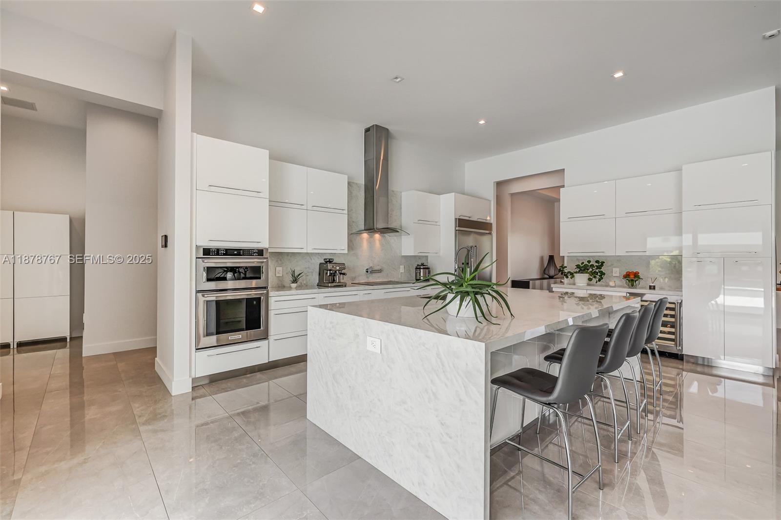 17950 Southwest 192nd Street Miami, FL 33187 - Photo 17 of 53 a view of kitchen with stainless steel appliances kitchen island granite countertop a stove and cabinets