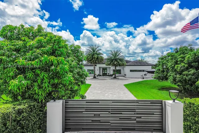 a view of a backyard with sitting area