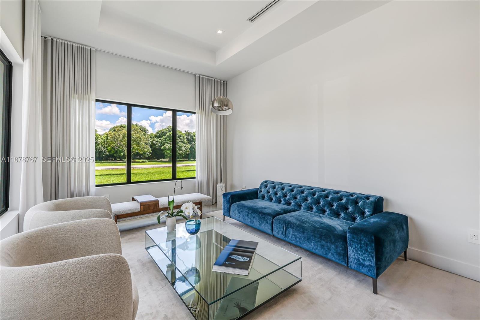 17950 Southwest 192nd Street Miami, FL 33187 - Photo 23 of 53 a living room with furniture and a large window