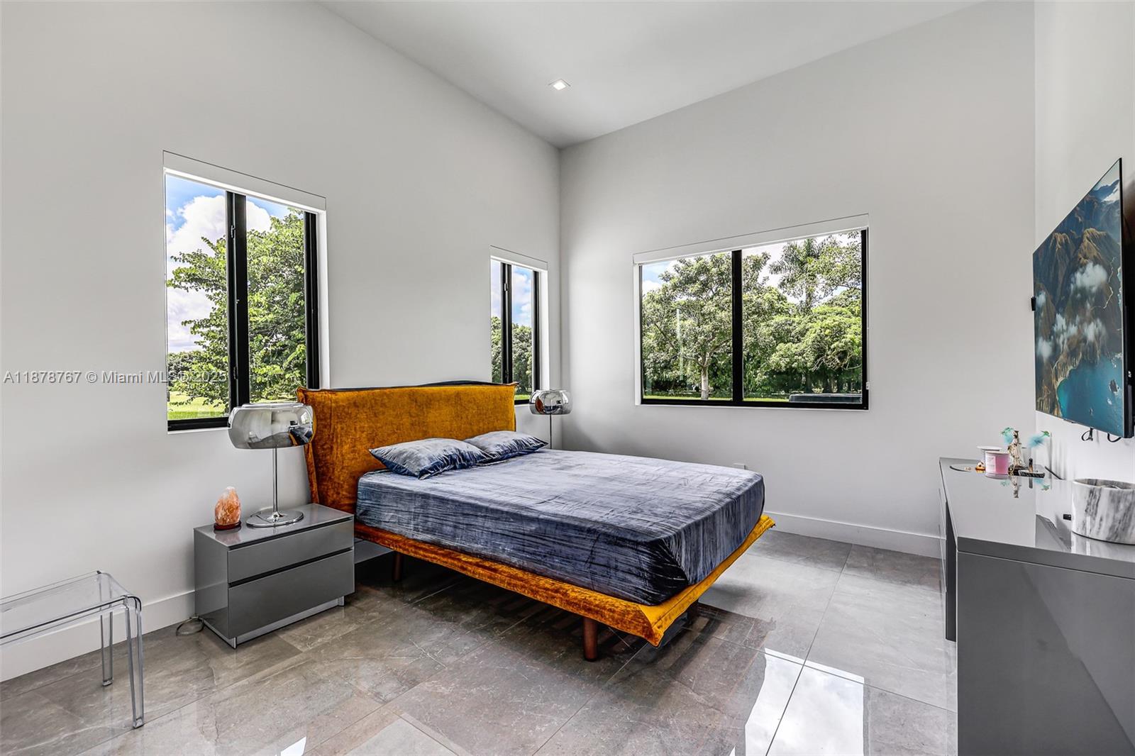 17950 Southwest 192nd Street Miami, FL 33187 - Photo 27 of 53 a bedroom with a bed and window