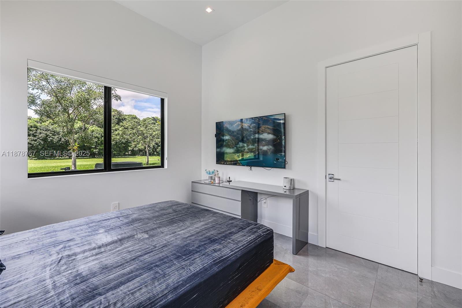 17950 Southwest 192nd Street Miami, FL 33187 - Photo 30 of 53 a room with a bed and a window