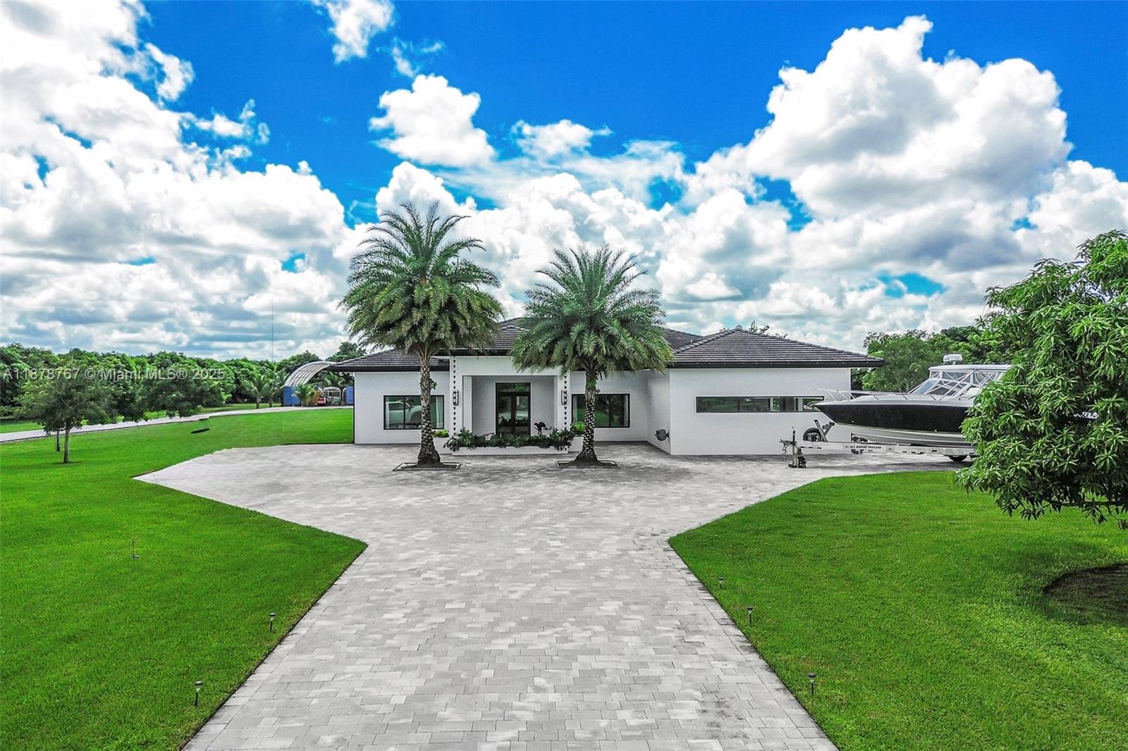 17950 Southwest 192nd Street Miami, FL 33187 - Photo 3 of 53 a view of a house with backyard and sitting area