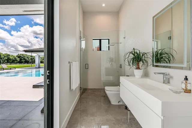 a bathroom with a sink a mirror and a bathtub