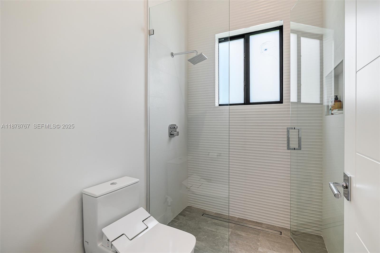 17950 Southwest 192nd Street Miami, FL 33187 - Photo 38 of 53 a bathroom with a toilet and a shower