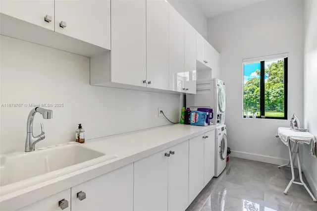 a kitchen with stainless steel appliances kitchen island granite countertop a table and chairs in it