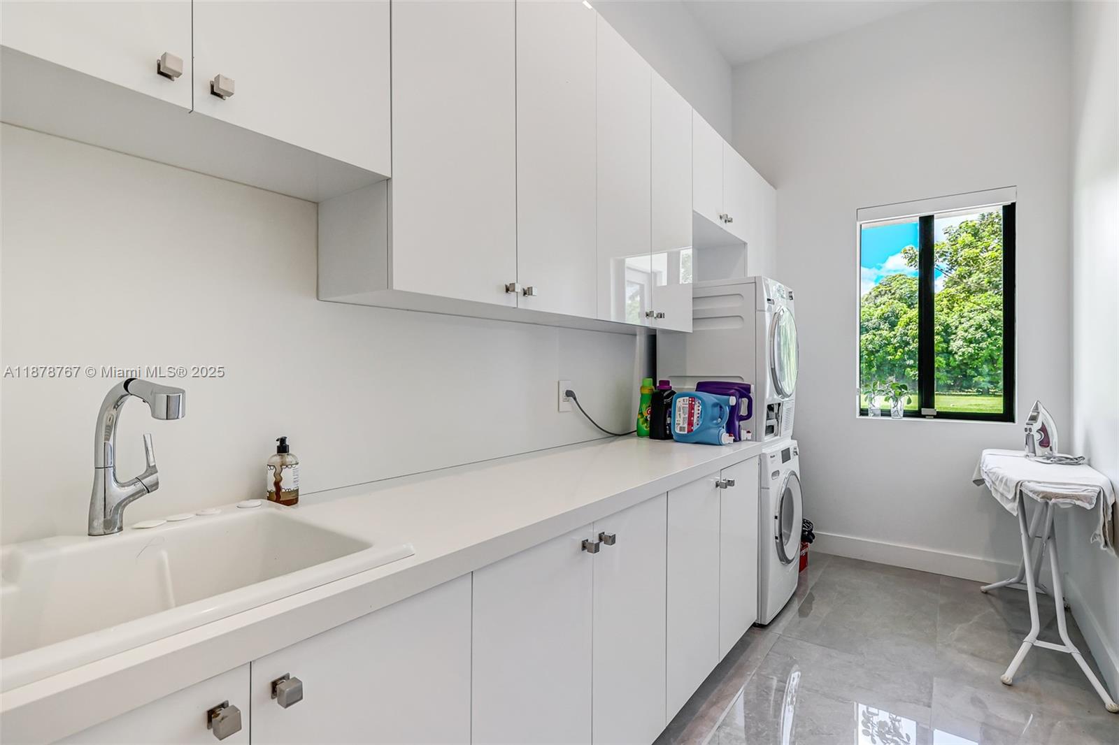 17950 Southwest 192nd Street Miami, FL 33187 - Photo 45 of 53 a kitchen with a sink cabinets and window