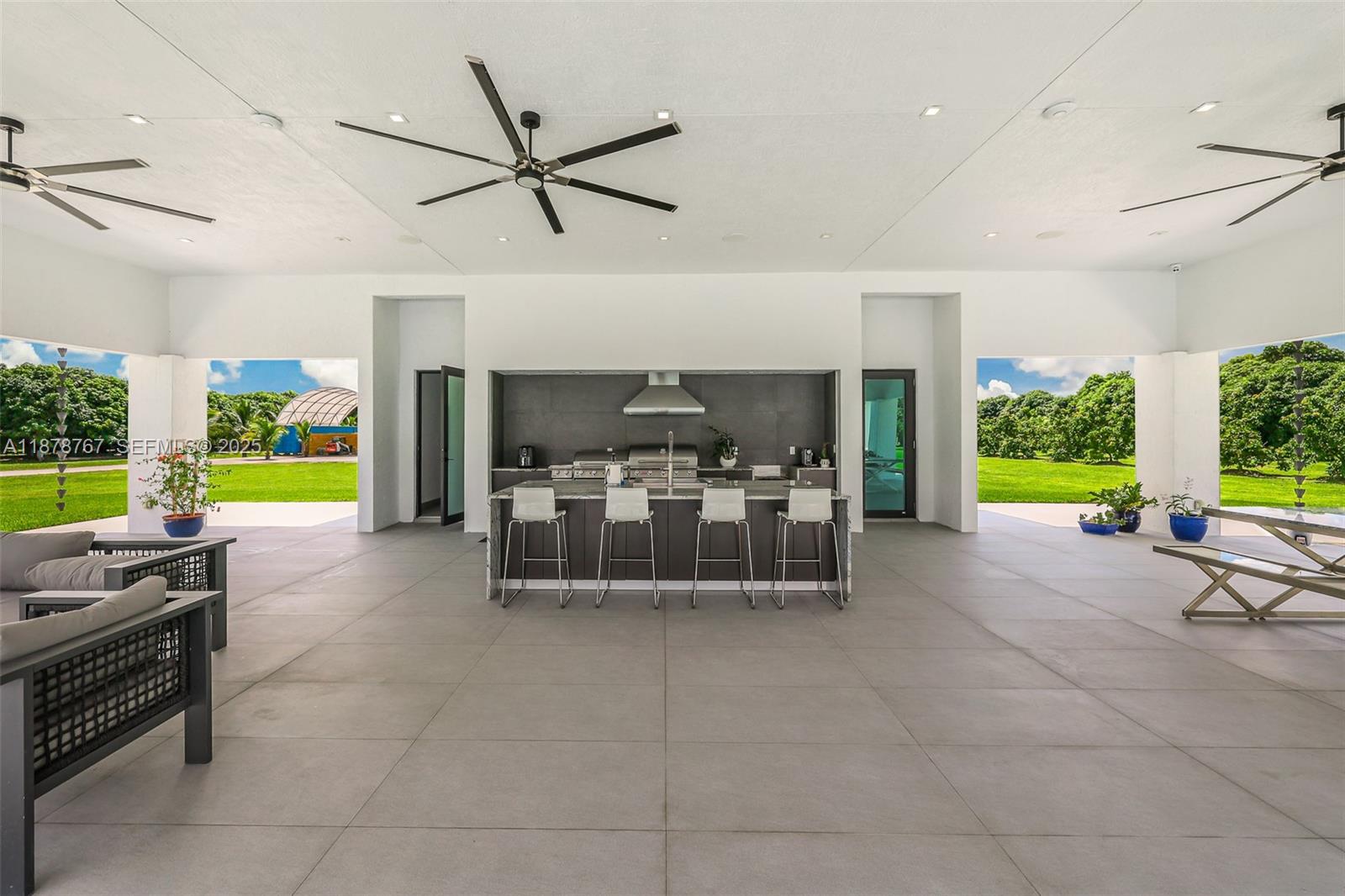 17950 Southwest 192nd Street Miami, FL 33187 - Photo 47 of 53 a room with furniture and a large window