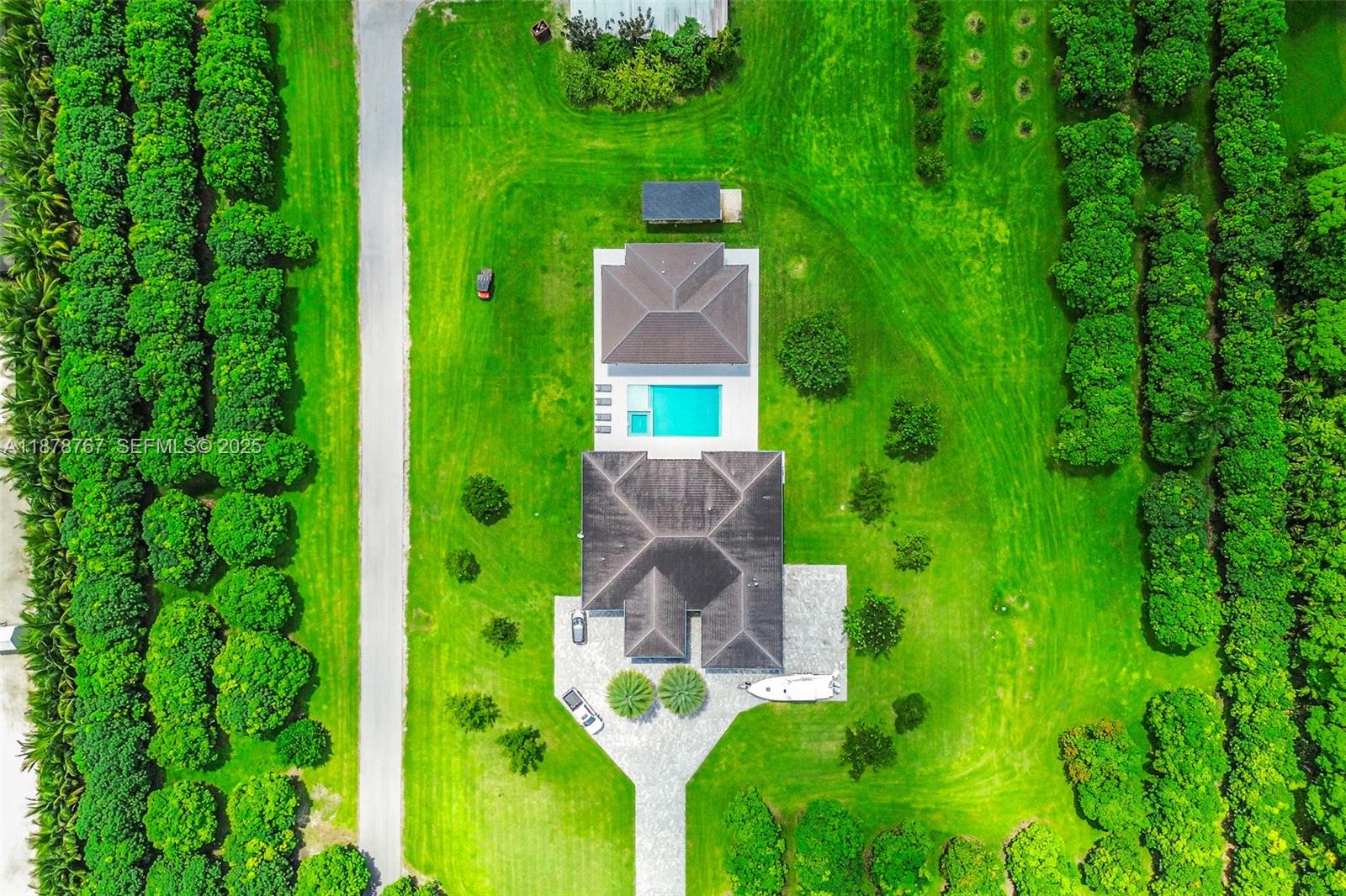 17950 Southwest 192nd Street Miami, FL 33187 - Photo 51 of 53 a aerial view of a house with a garden