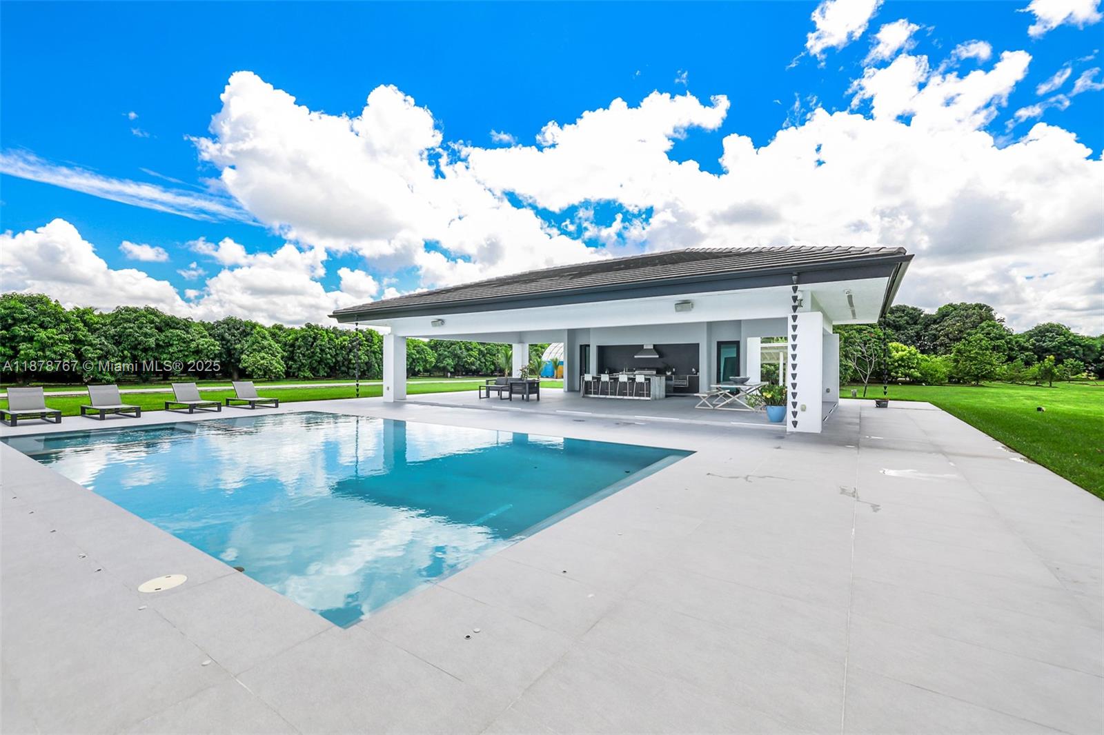 17950 Southwest 192nd Street Miami, FL 33187 - Photo 9 of 53 front view of a house with a big yard