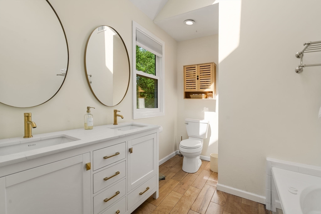 11 Cow Hill Road Sharon, MA 02067 - Photo 22 of 30 a bathroom with a toilet a sink and a mirror