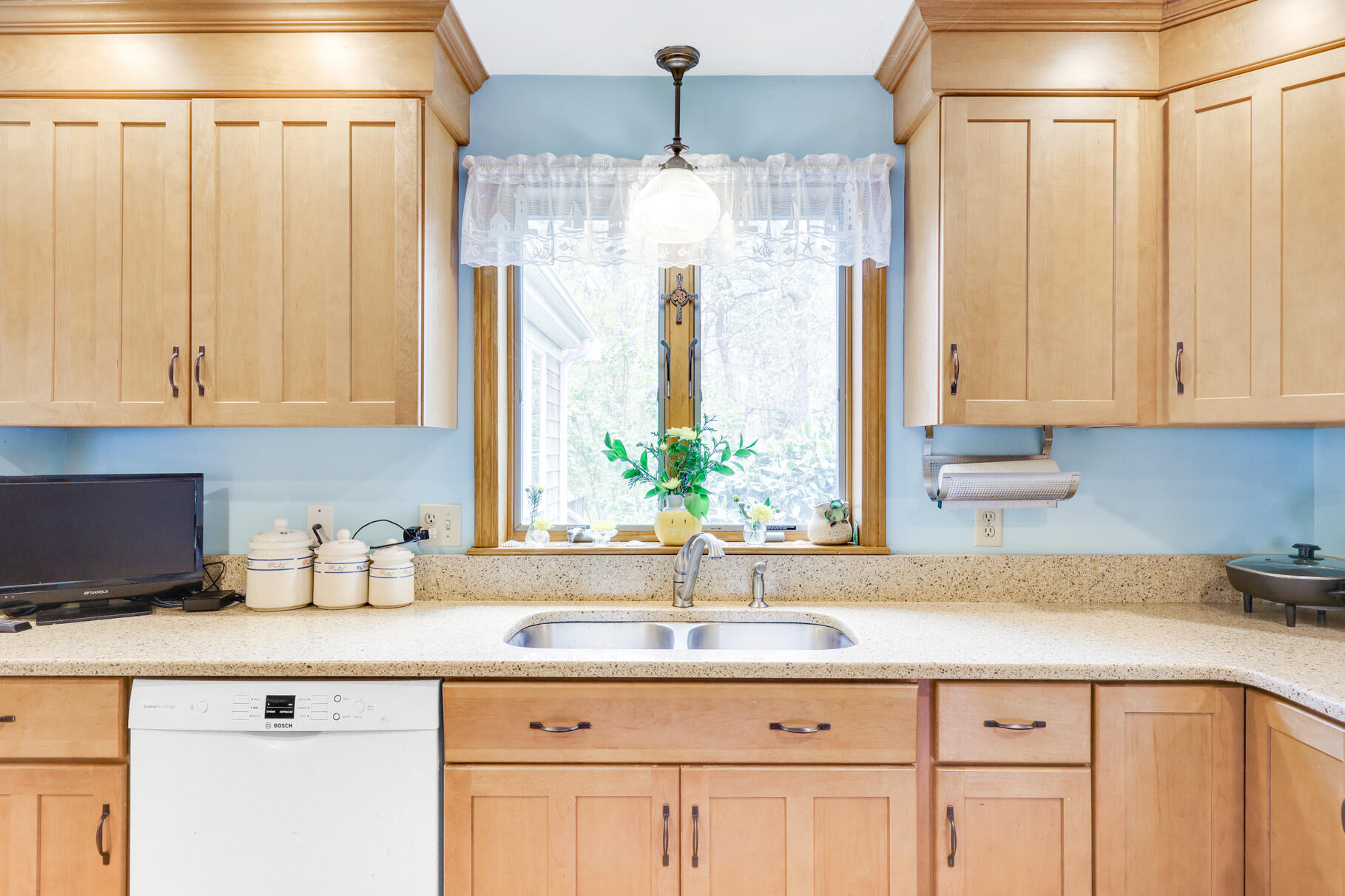 65 Continental Drive Harwich, MA 02645 - Photo 12 of 34 a kitchen with stainless steel appliances granite countertop a sink and a white cabinets