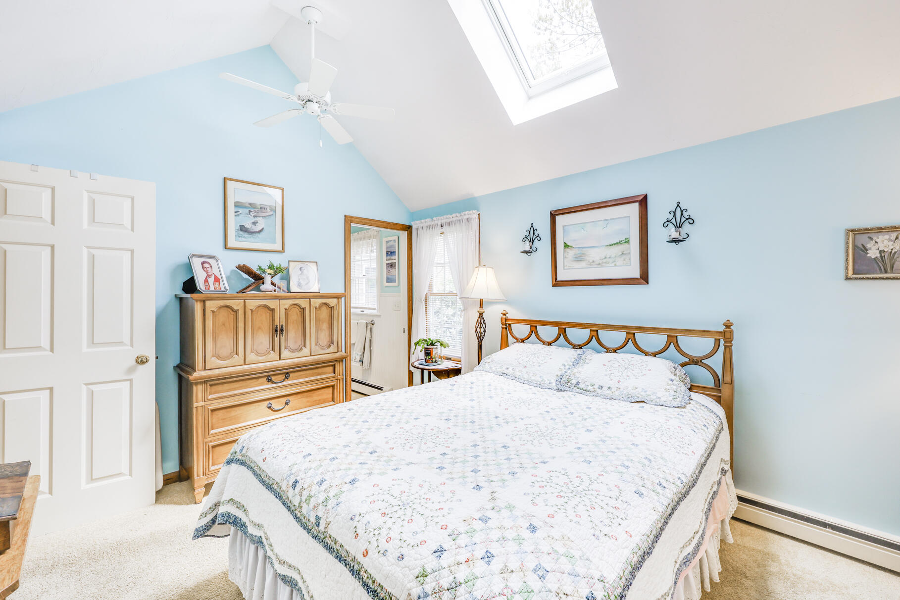 65 Continental Drive Harwich, MA 02645 - Photo 20 of 34 a bedroom with a bed and a dresser in it