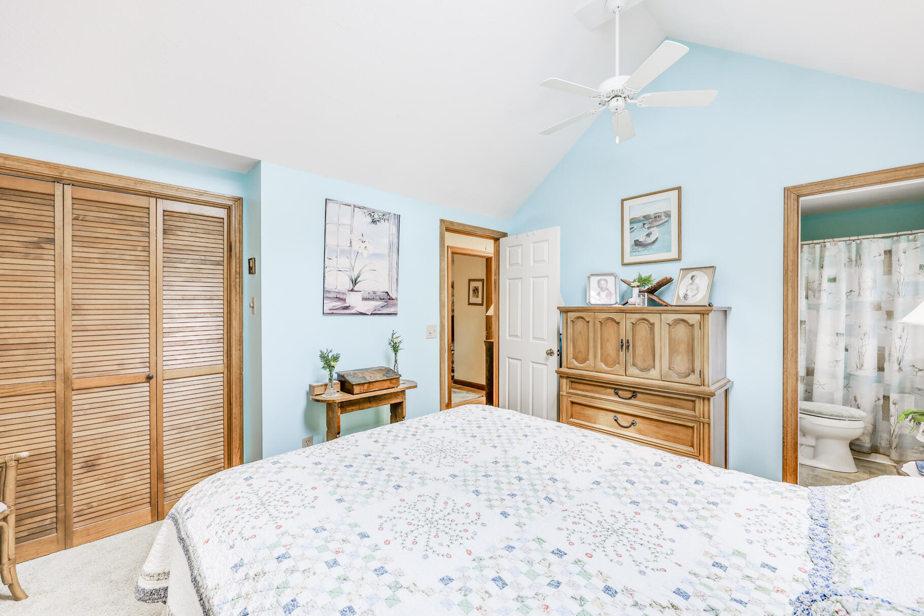 65 Continental Drive Harwich, MA 02645 - Photo 21 of 34 a bedroom with a bed and wooden floor