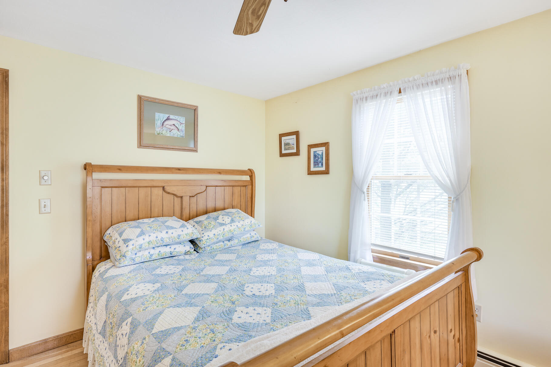 65 Continental Drive Harwich, MA 02645 - Photo 22 of 34 a bedroom with a bed and a window