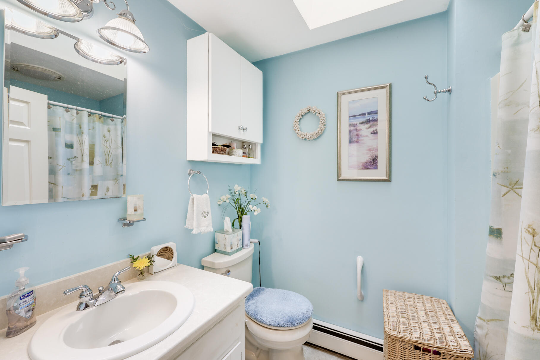 65 Continental Drive Harwich, MA 02645 - Photo 25 of 34 a bathroom with a sink toilet and mirror