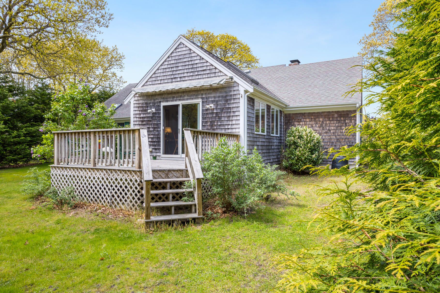 65 Continental Drive Harwich, MA 02645 - Photo 28 of 34 a front view of a house with a garden