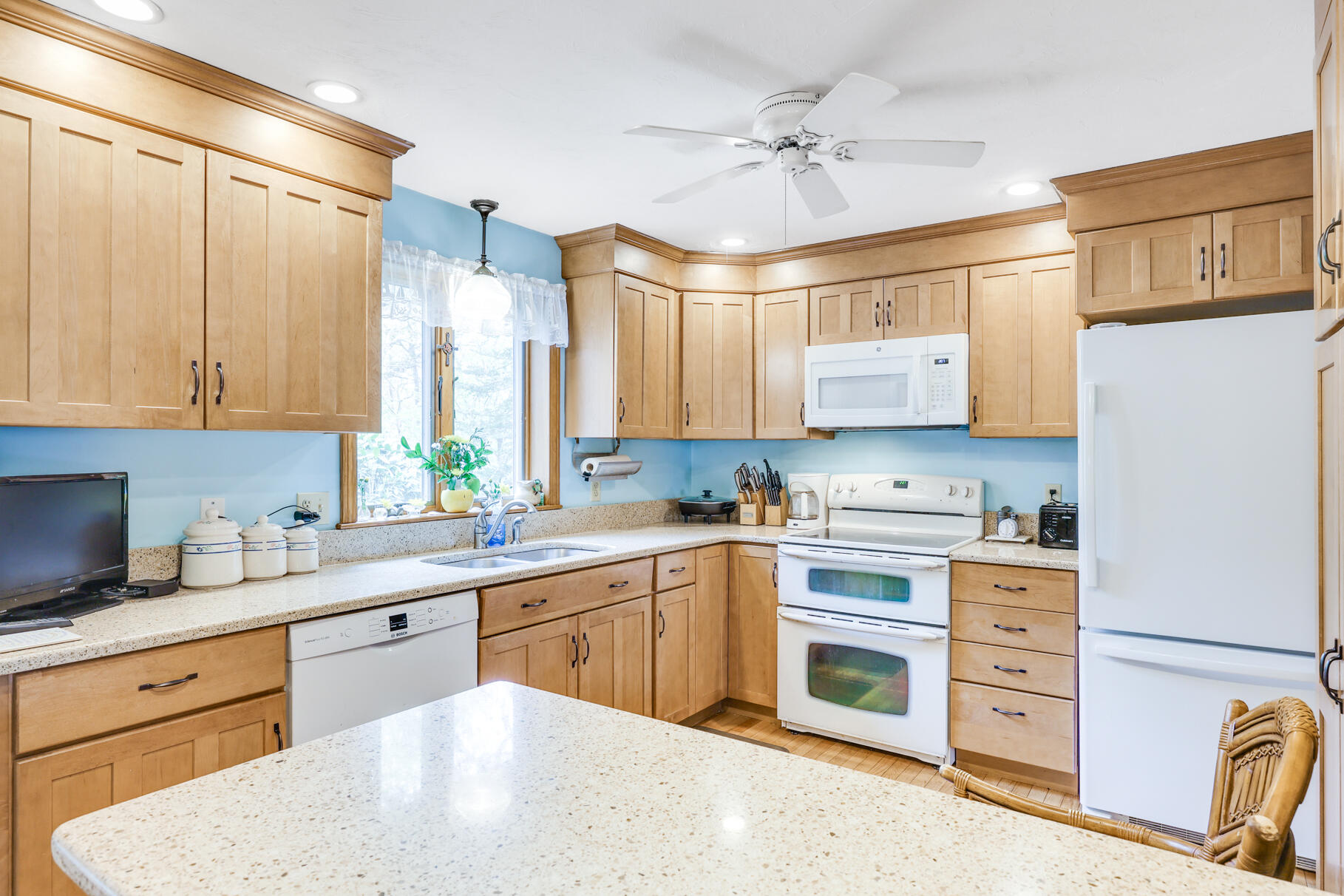 65 Continental Drive Harwich, MA 02645 - Photo 10 of 34 a kitchen with stainless steel appliances a stove sink and cabinets