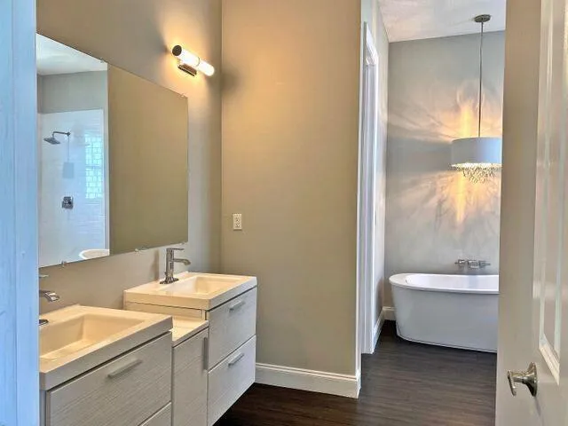 a bathroom with a toilet a sink and a bathtub