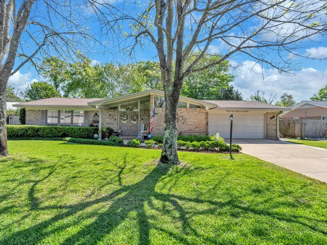 front view of a house with a big yard