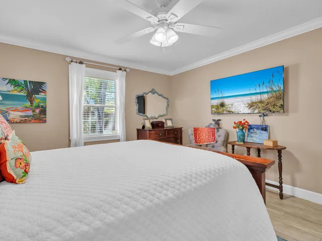 a bed room with a bed and a chandelier