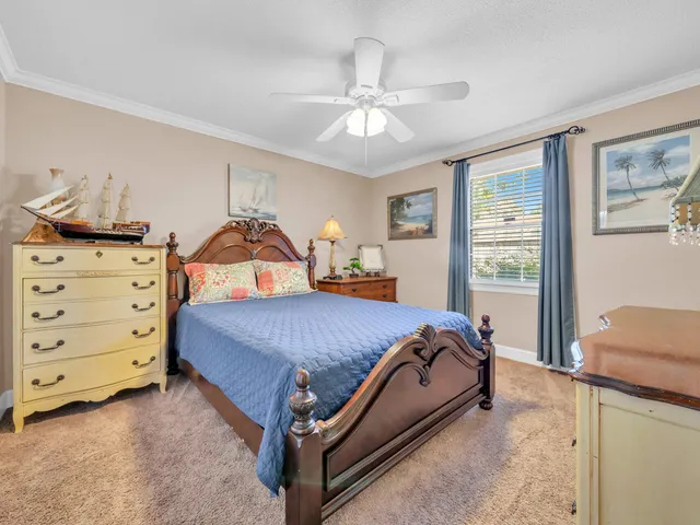 a bed room with a bed and a dresser