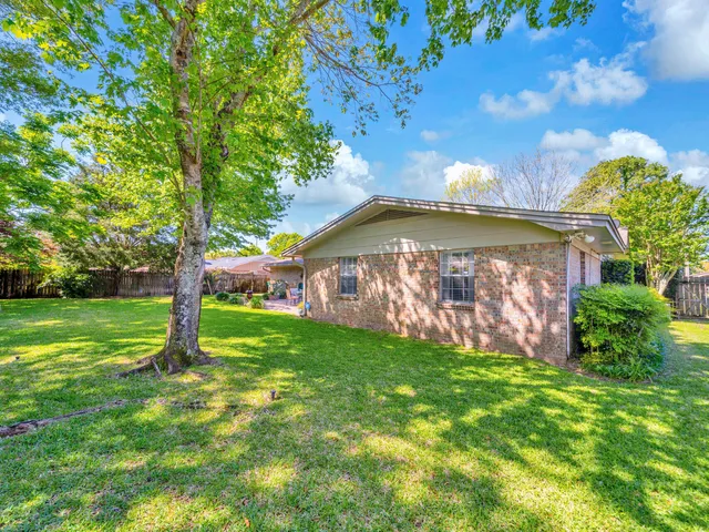 a view of a backyard with a garden