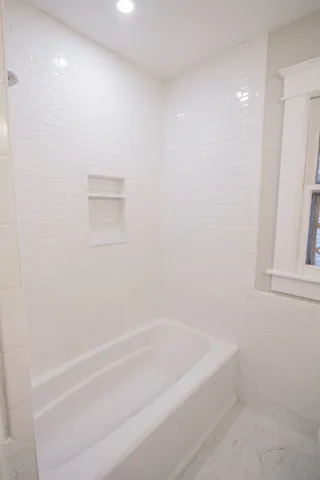 a bathroom with a bathtub