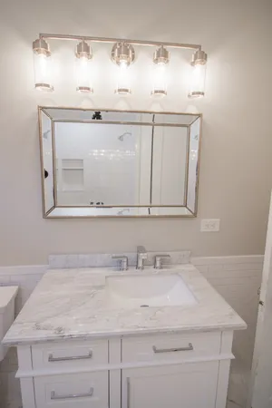 a bathroom with a sink and a mirror