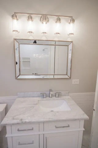 a bathroom with a sink and a mirror