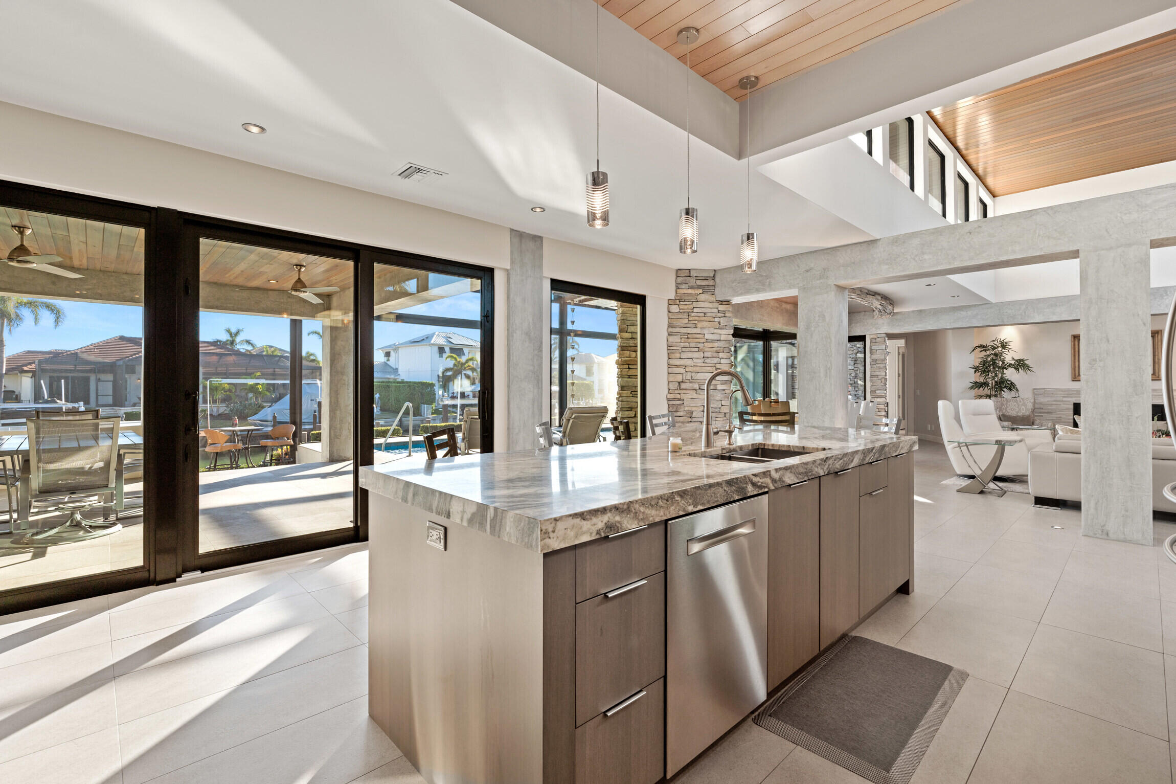 821 Magnolia Court Marco Island, FL 34145 - Photo 14 of 53 a large white kitchen with a large window