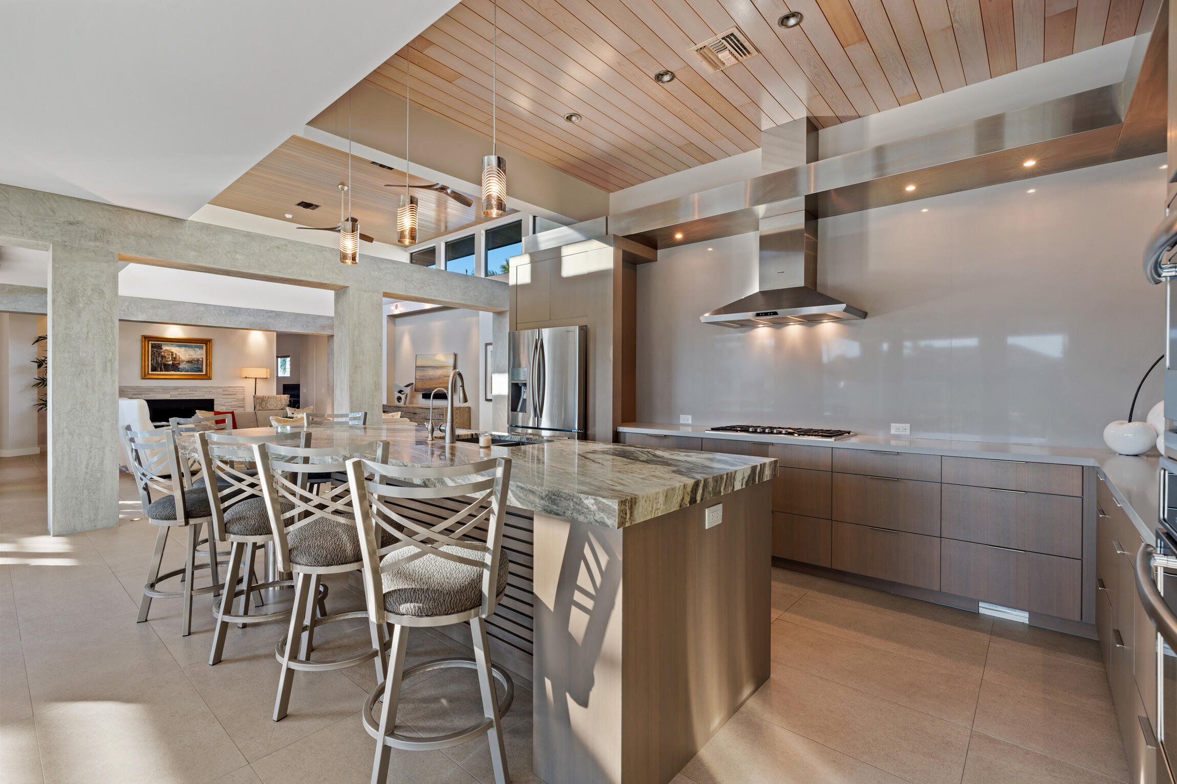 821 Magnolia Court Marco Island, FL 34145 - Photo 15 of 53 a kitchen with cabinets and chairs