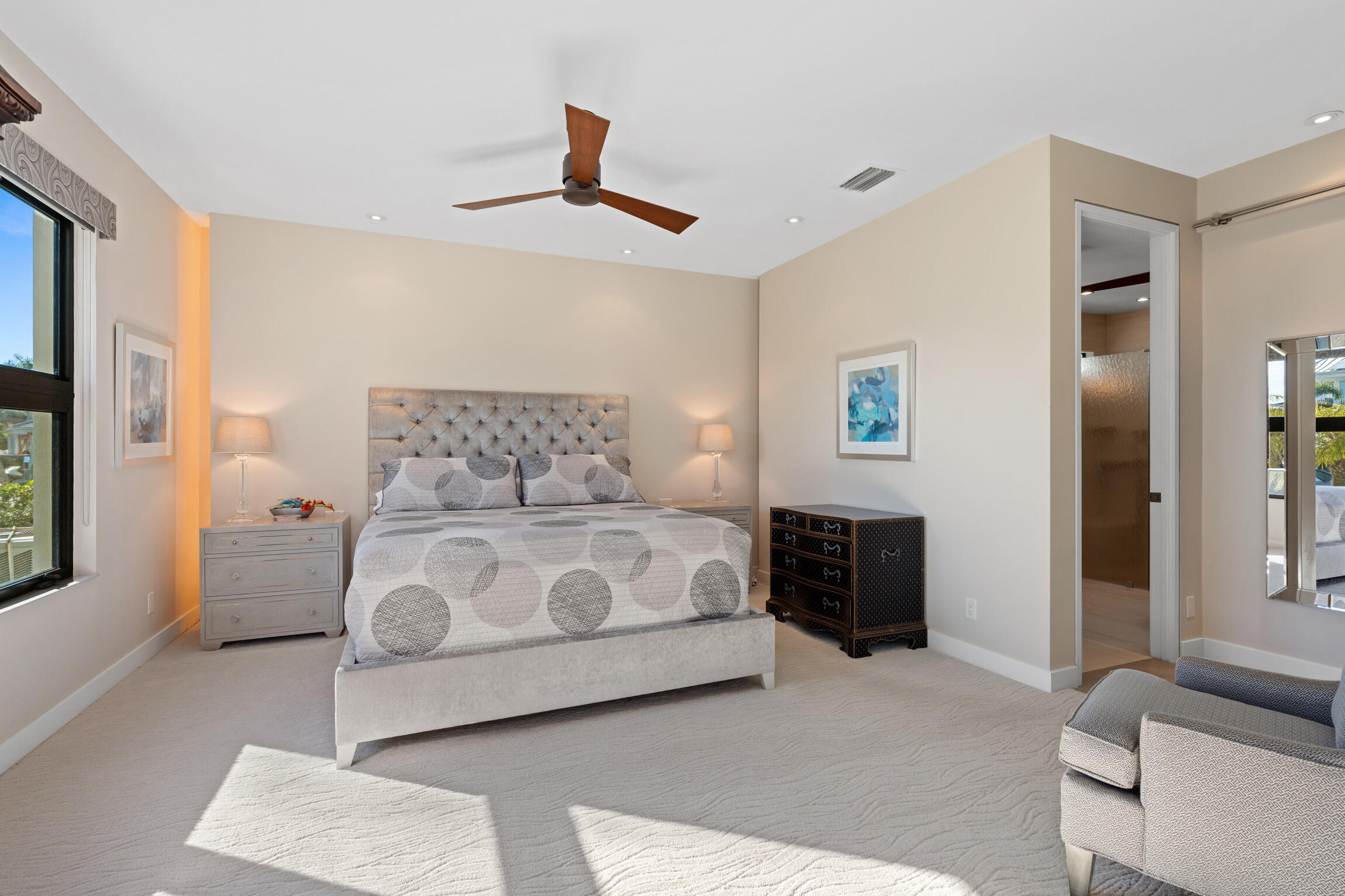 821 Magnolia Court Marco Island, FL 34145 - Photo 26 of 53 a bedroom with a large bed and a chandelier