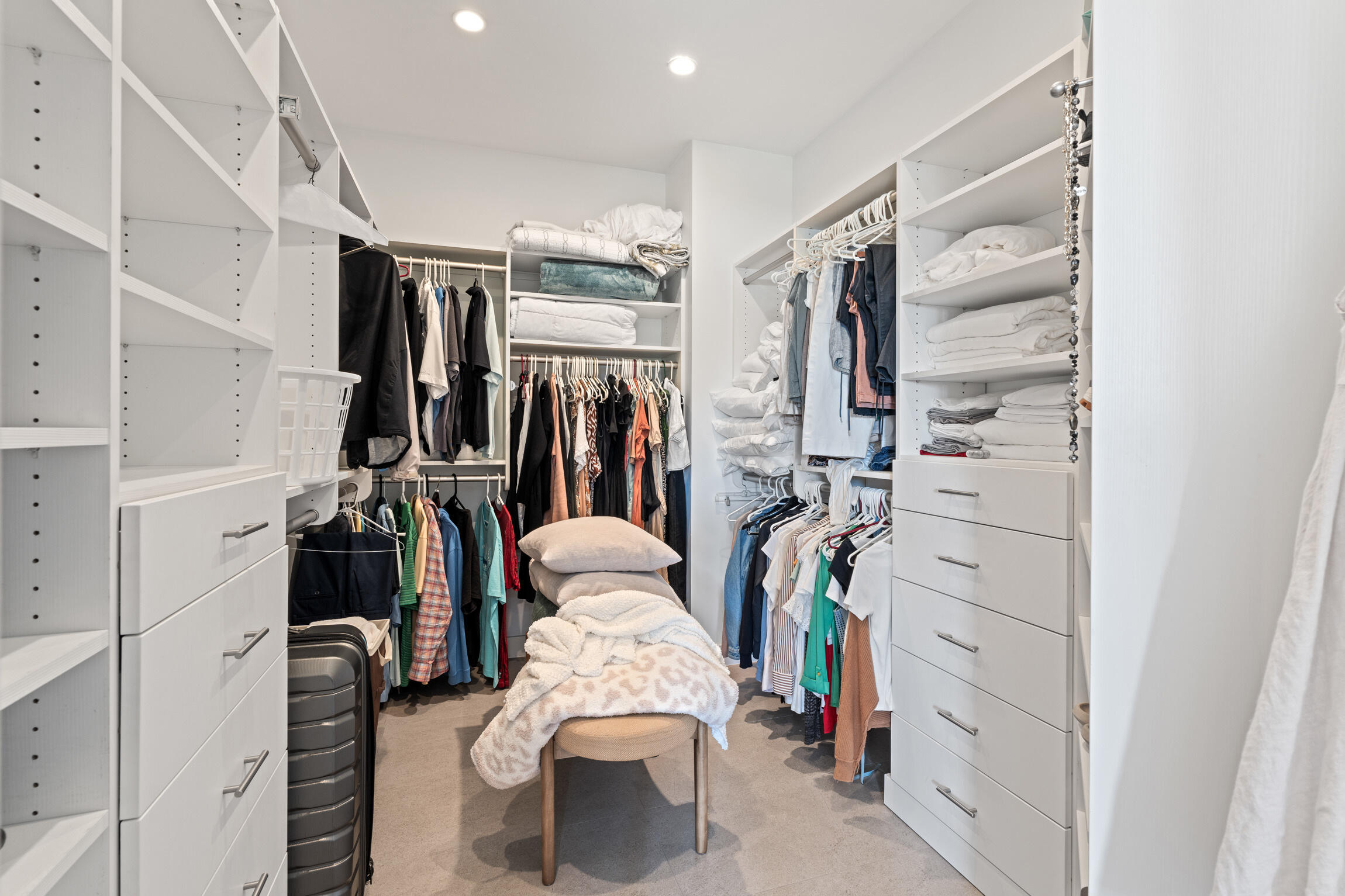 821 Magnolia Court Marco Island, FL 34145 - Photo 29 of 53 a walk in closet with clothes and shoes