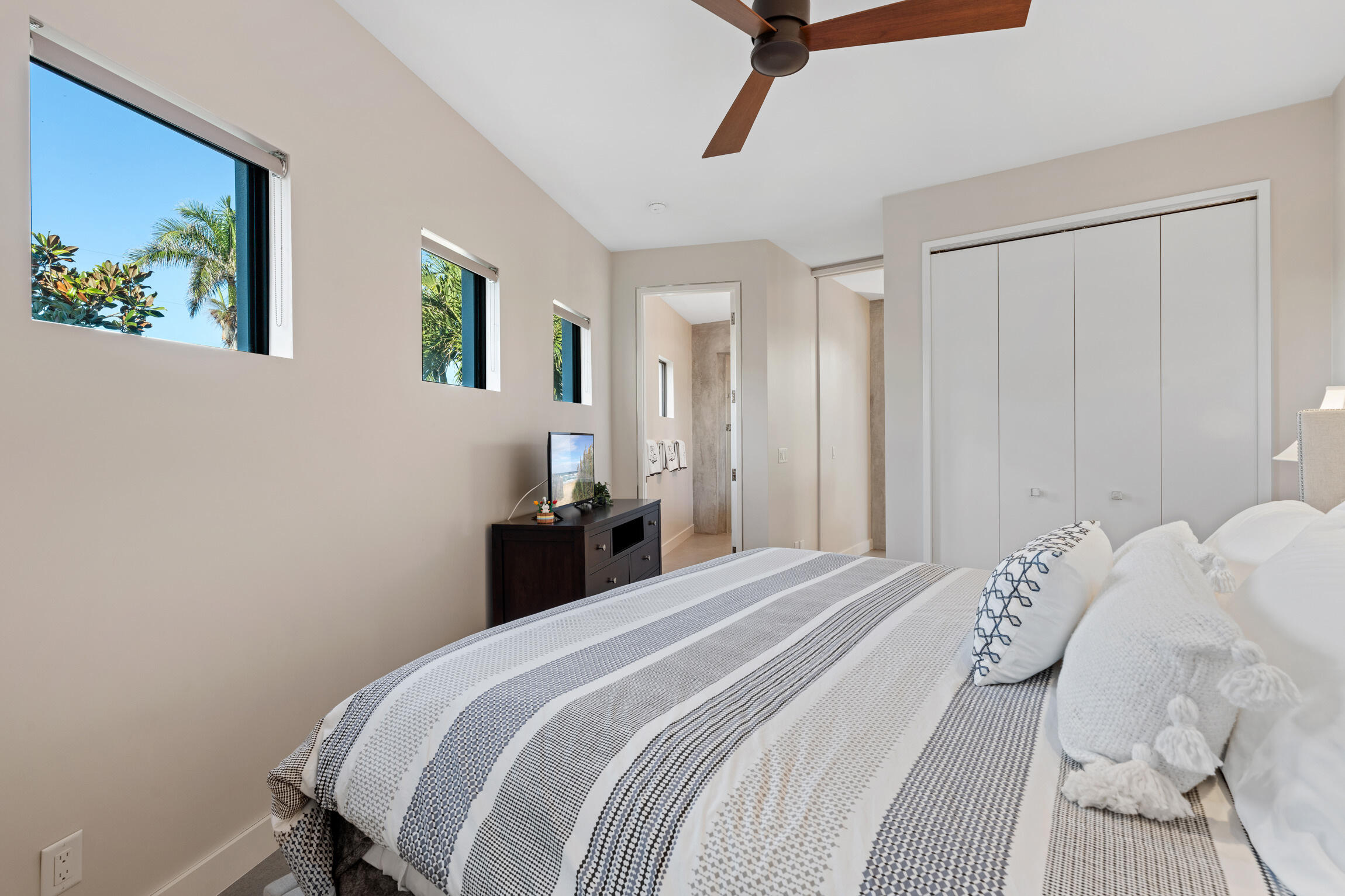 821 Magnolia Court Marco Island, FL 34145 - Photo 30 of 53 a bedroom with a bed and a painting on the wall