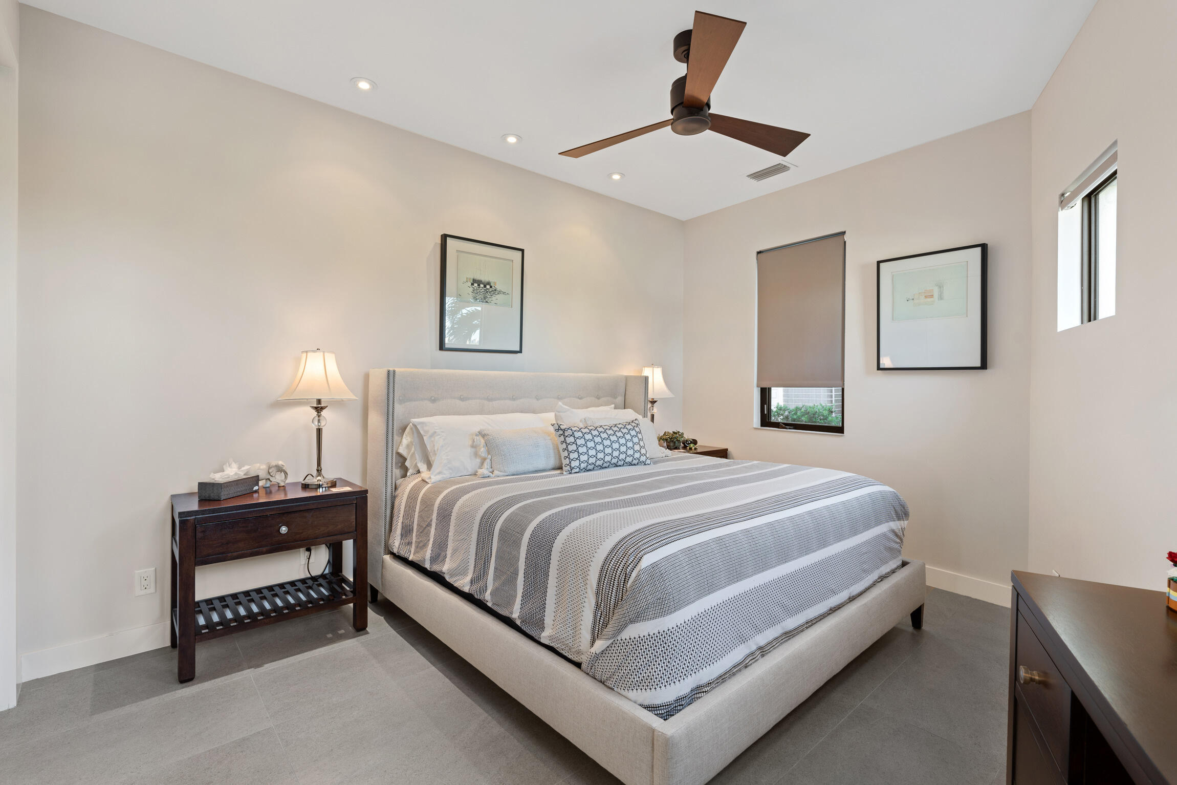 821 Magnolia Court Marco Island, FL 34145 - Photo 31 of 53 a bedroom with a bed and a lamp