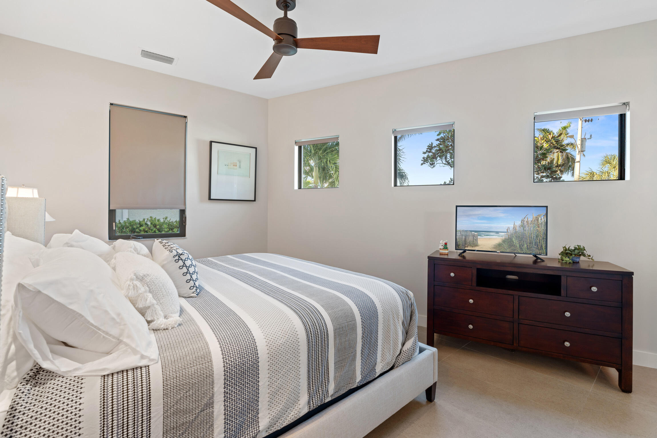 821 Magnolia Court Marco Island, FL 34145 - Photo 32 of 53 a bedroom with a bed and a lamp on dresser