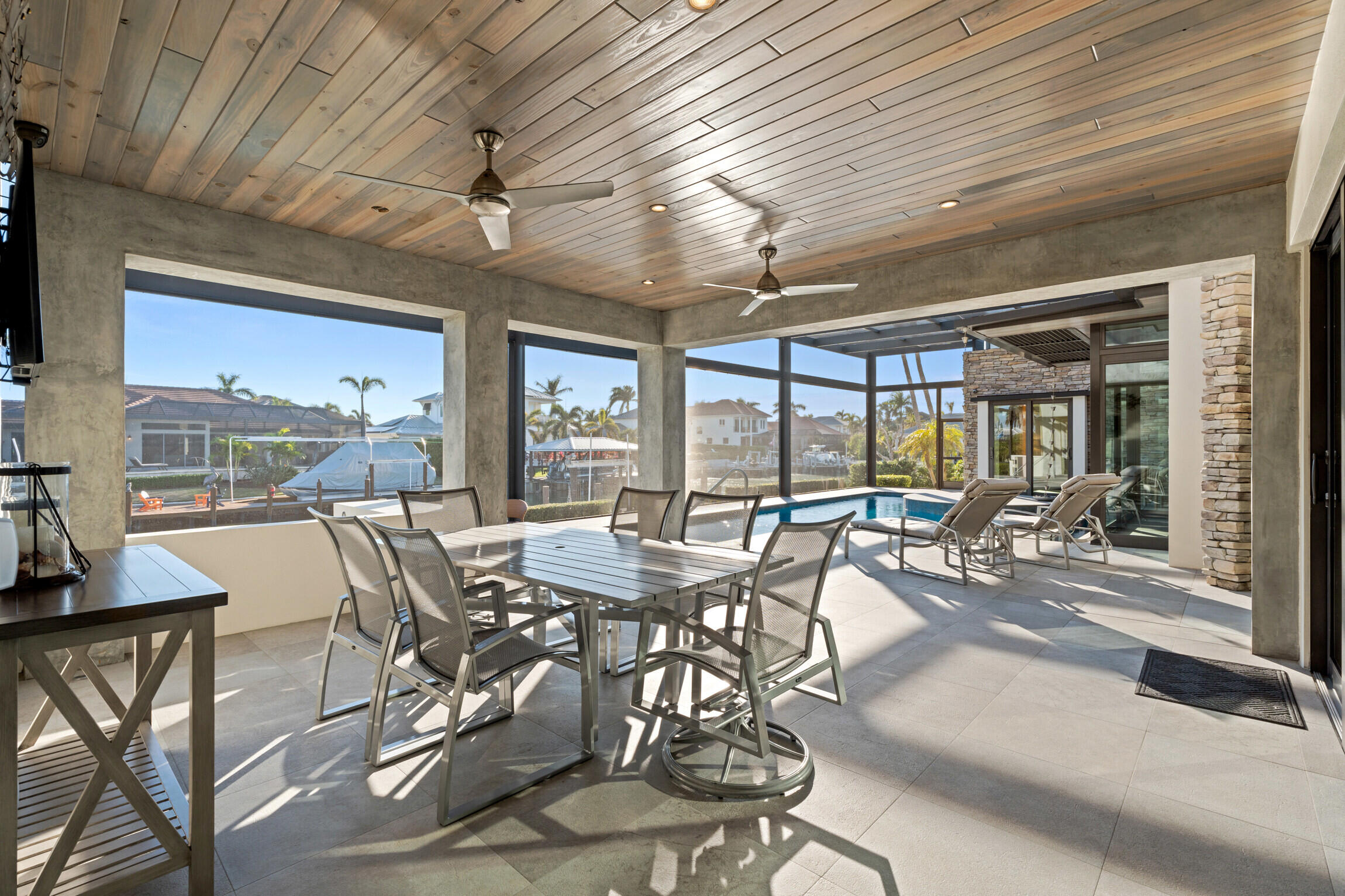 821 Magnolia Court Marco Island, FL 34145 - Photo 37 of 53 a view of a dining room with furniture wooden floor and chandelier