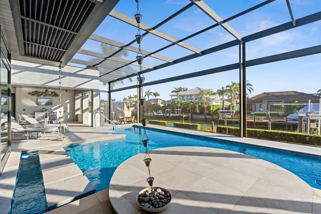 a view of a swimming pool with a patio