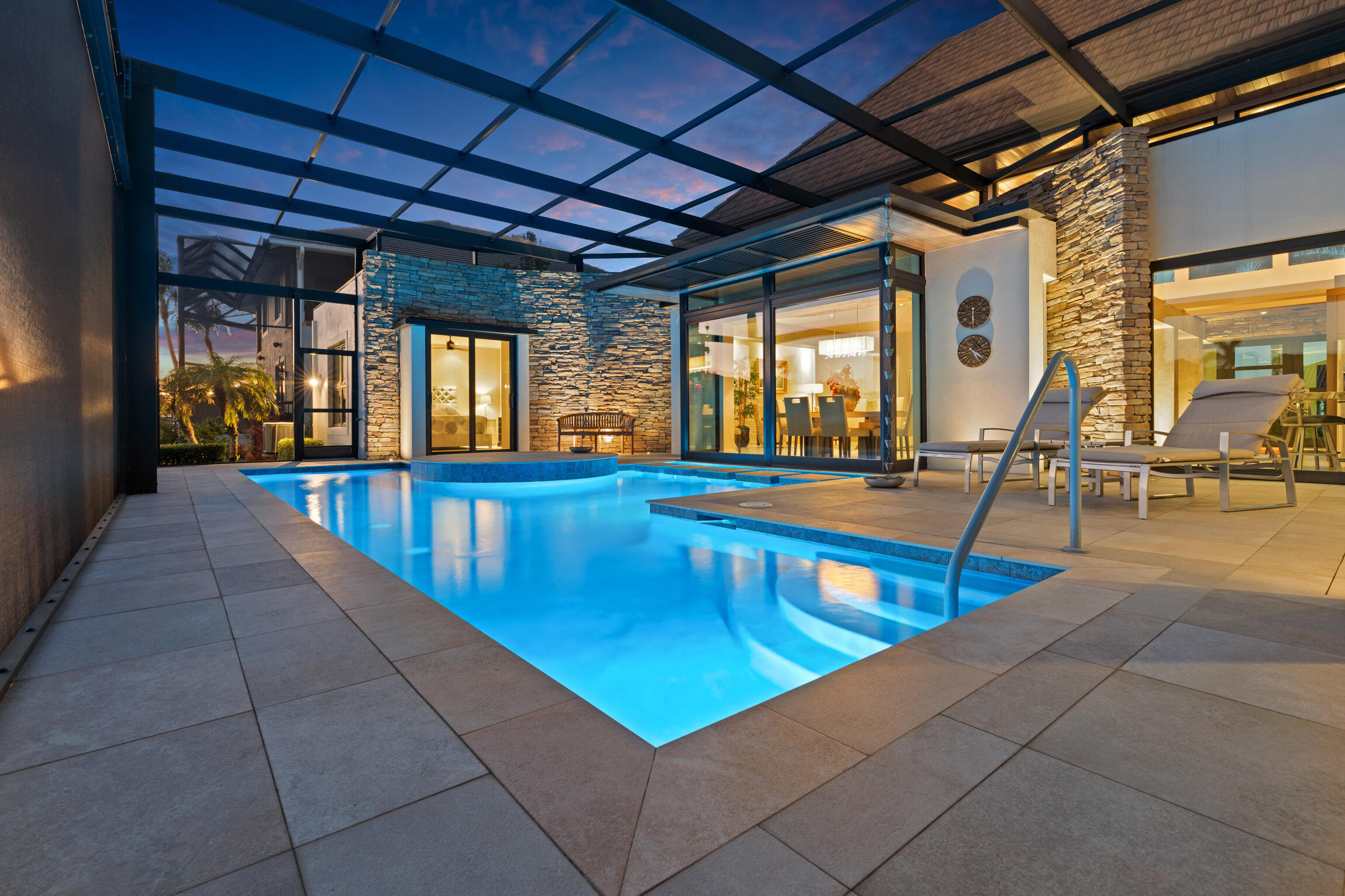 821 Magnolia Court Marco Island, FL 34145 - Photo 49 of 53 a view of a swimming pool with chairs in a patio